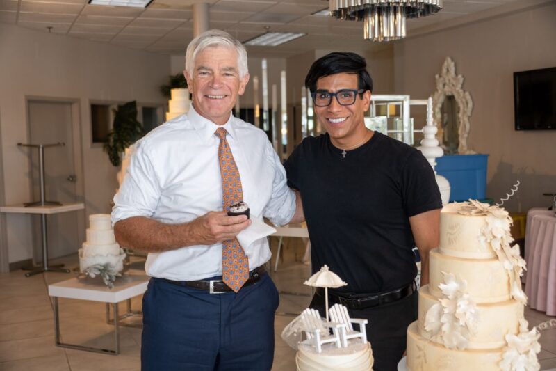 President of the Federal reserve Bank of Philadelphia, Patrick Harker, poses with owner of House of Clarendon, Martine Cajas.