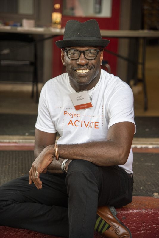 Man poses for camera in Project activate shirt
