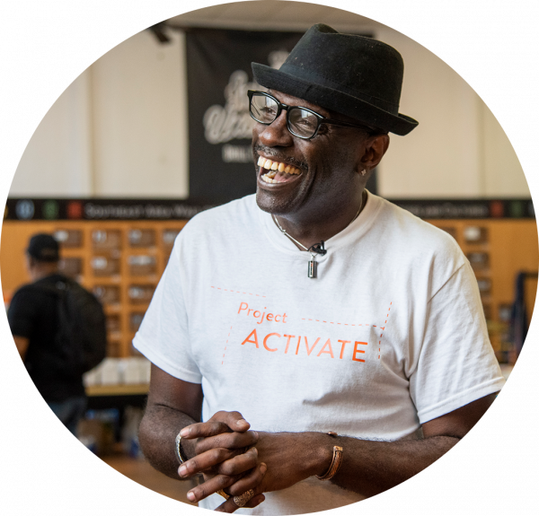 Man smiling in project activate shirt