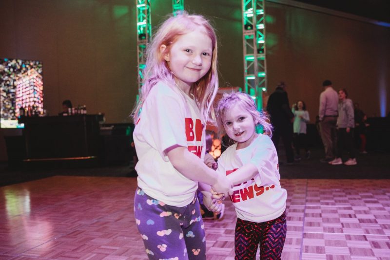 Two children dance at 2019 extra give