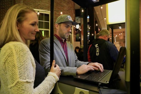 Two people donate at Extra Give 2019