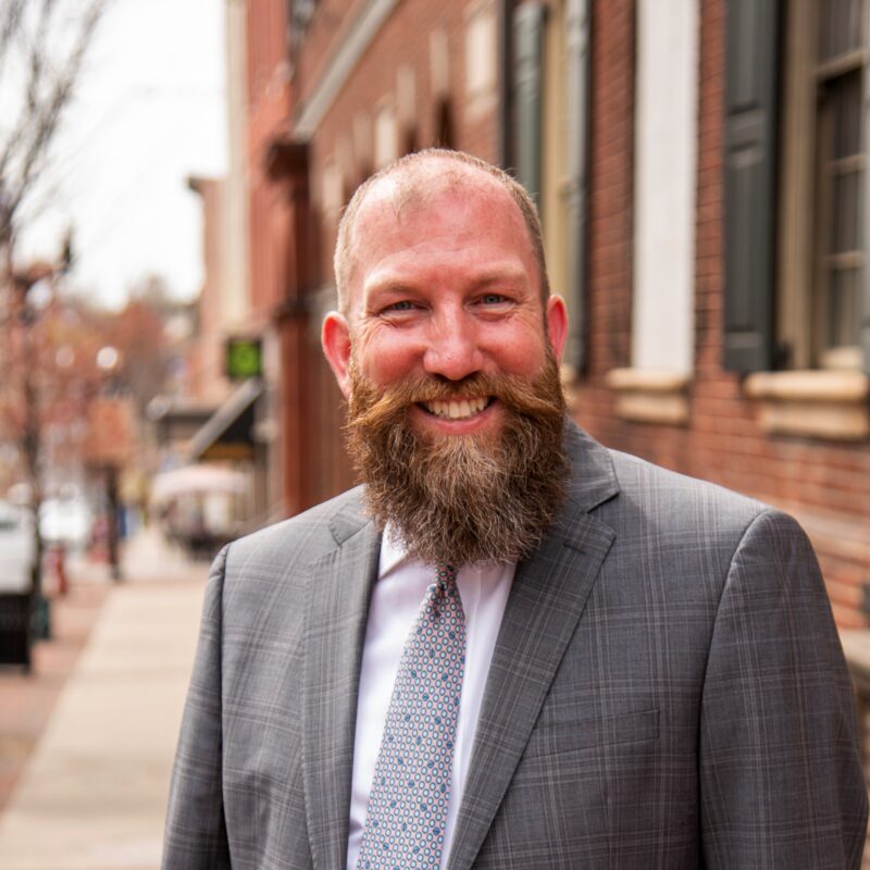 man with beard standing near Central Market