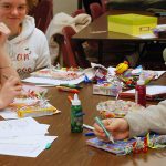 photo of students doing crafts at a table