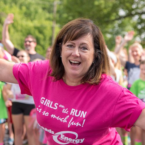 Picture of woman smiling at Girls on a Run event