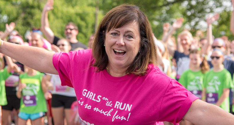 Picture of woman smiling at Girls on a Run event