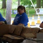 Group of people packing boxes