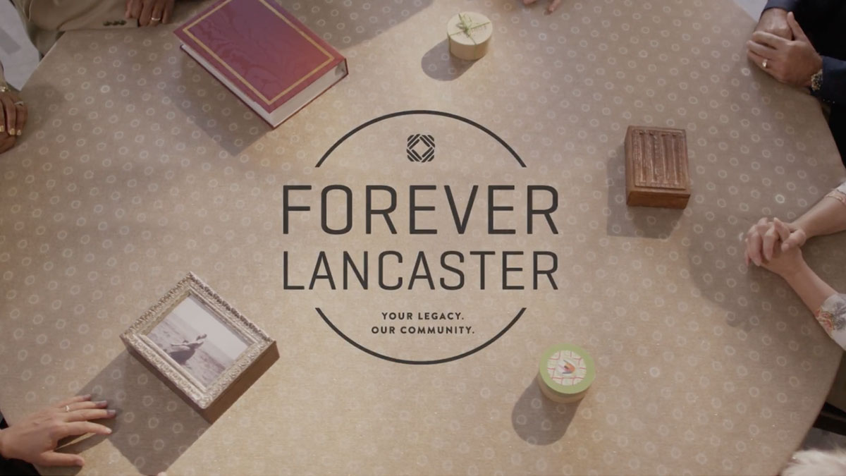 The Forever Lancaster photo surrounded by items that have meaning to different donors
