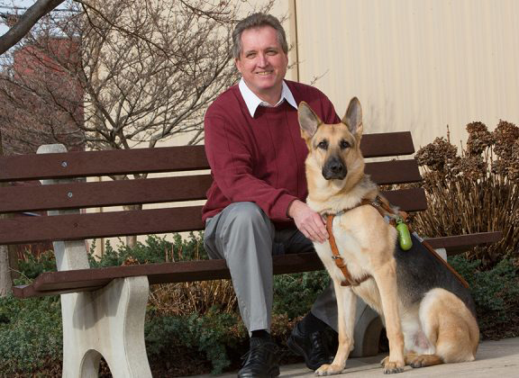 Man with a dog for vision corps